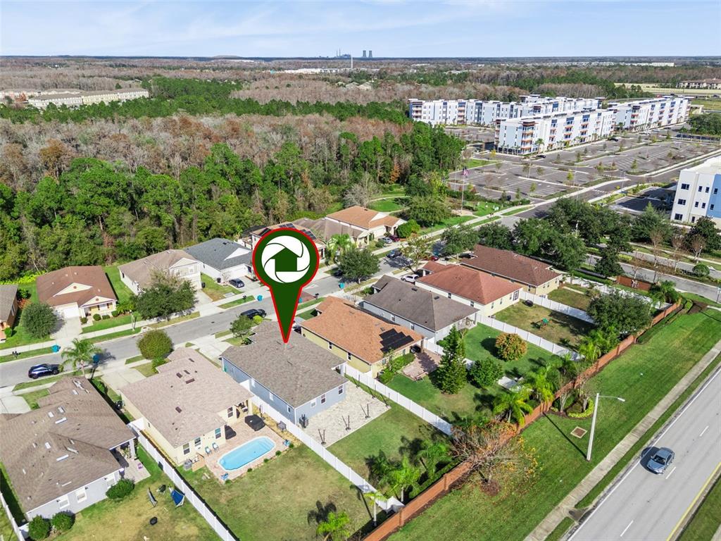 10544 Moss Rose Way Orlando, FL 32832 - Photo 35 of 40 an aerial view of multiple houses with yard