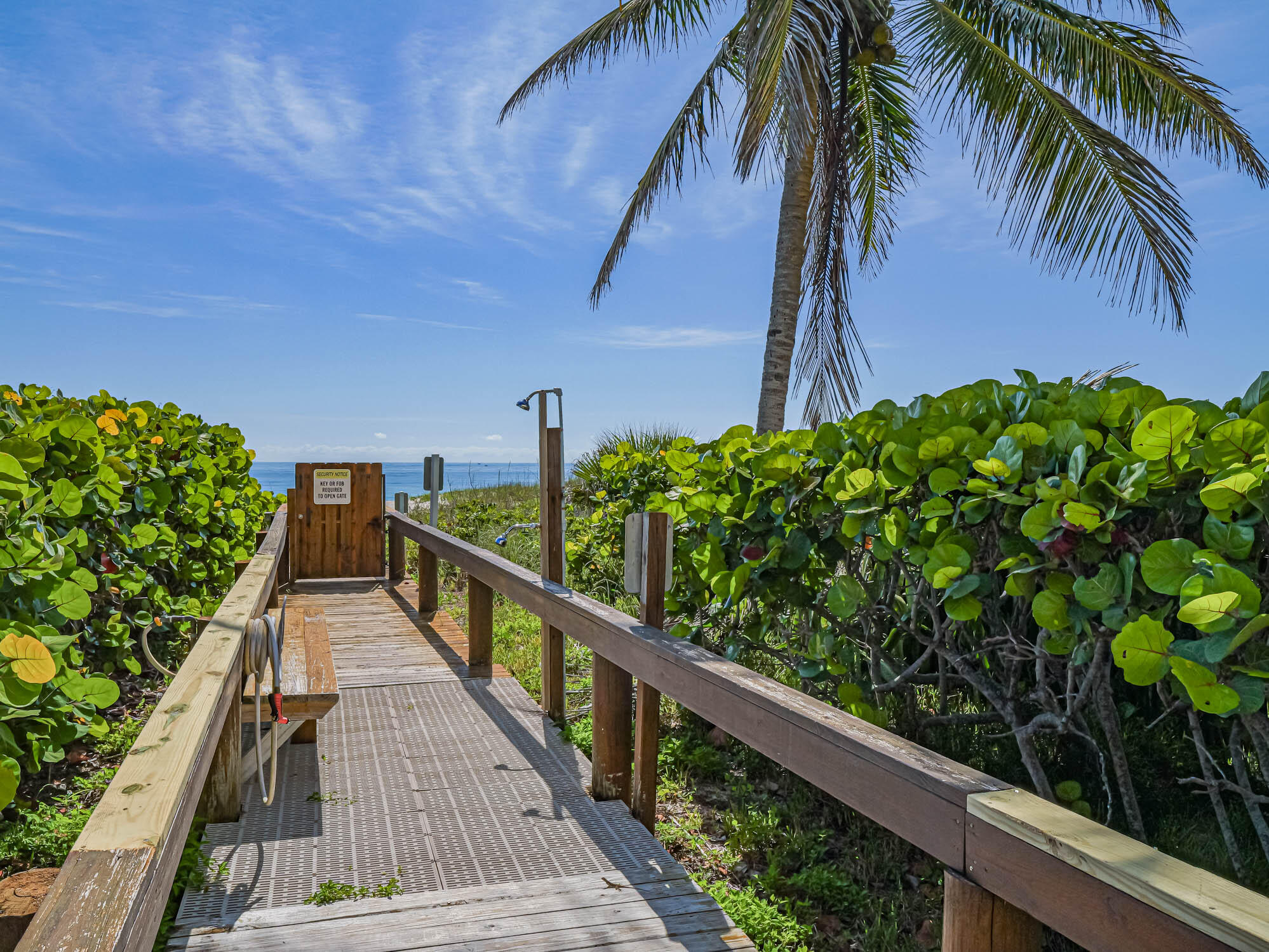 3200 North Hwy A1A, Unit 307 Hutchinson Island, FL 34949 - Photo 19 of 47 a view of balcony with wooden floor and fence
