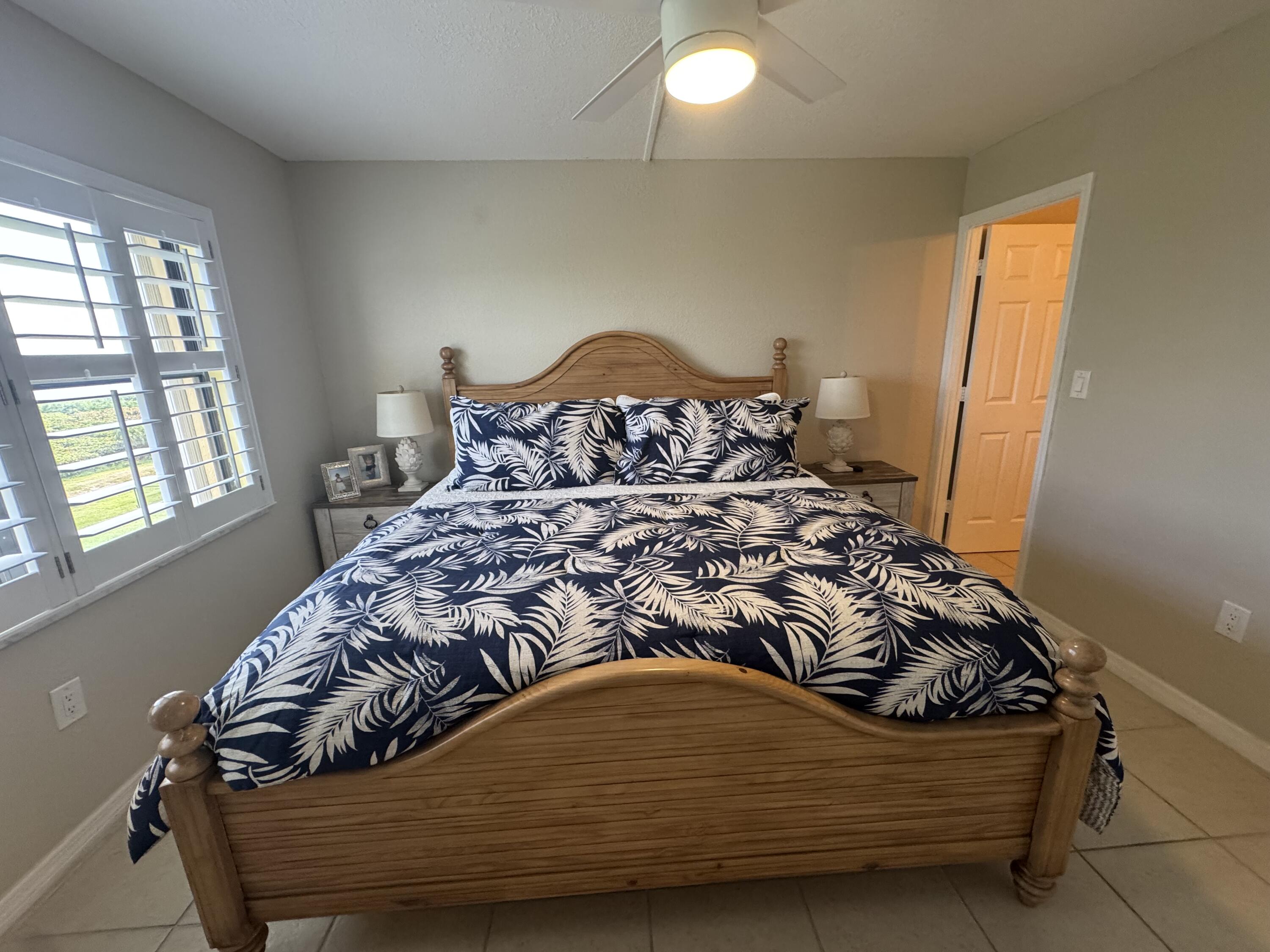 3200 North Hwy A1A, Unit 307 Hutchinson Island, FL 34949 - Photo 33 of 47 a bedroom with a bed and window