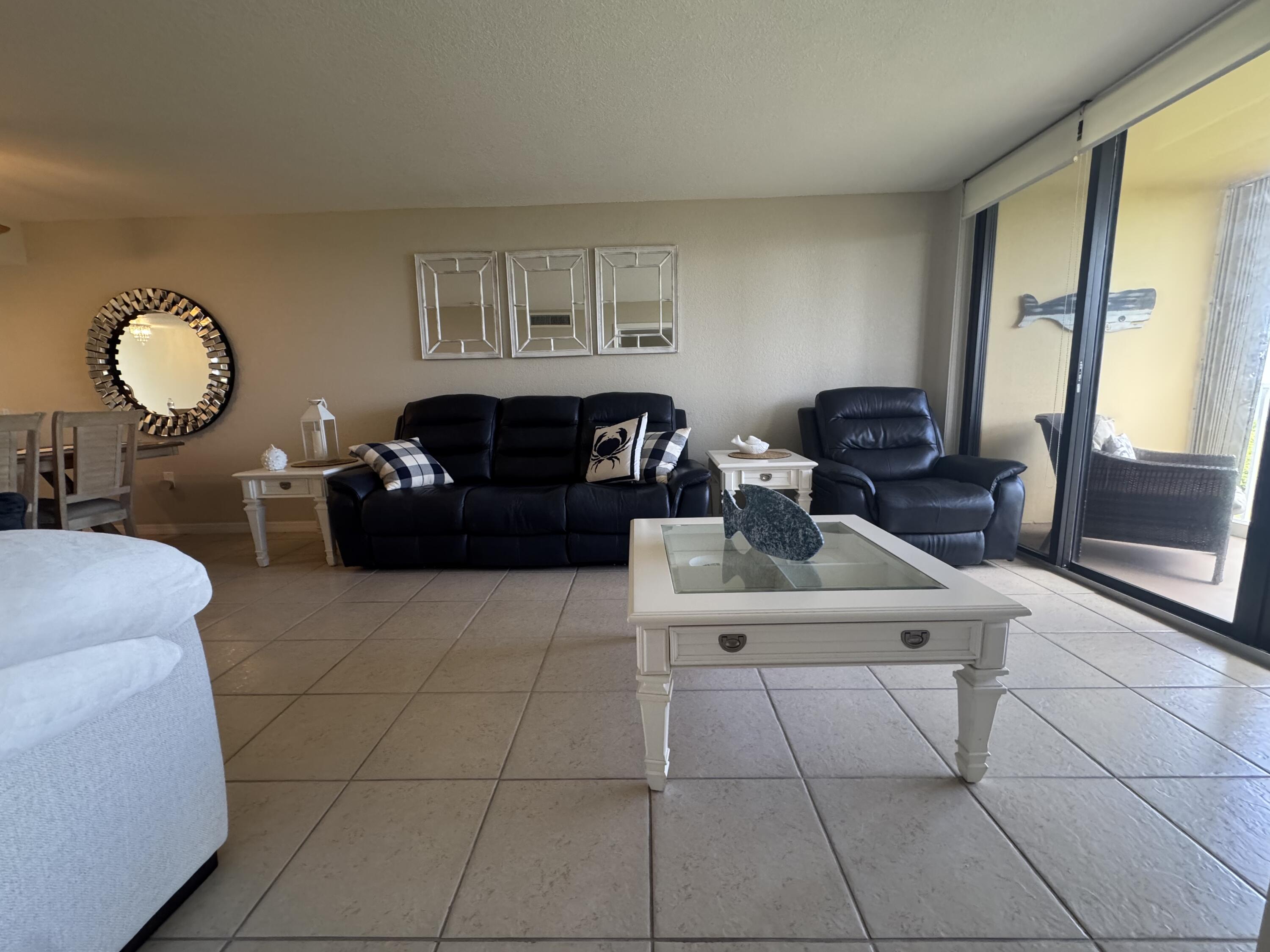 3200 North Hwy A1A, Unit 307 Hutchinson Island, FL 34949 - Photo 38 of 47 a living room with furniture and a window