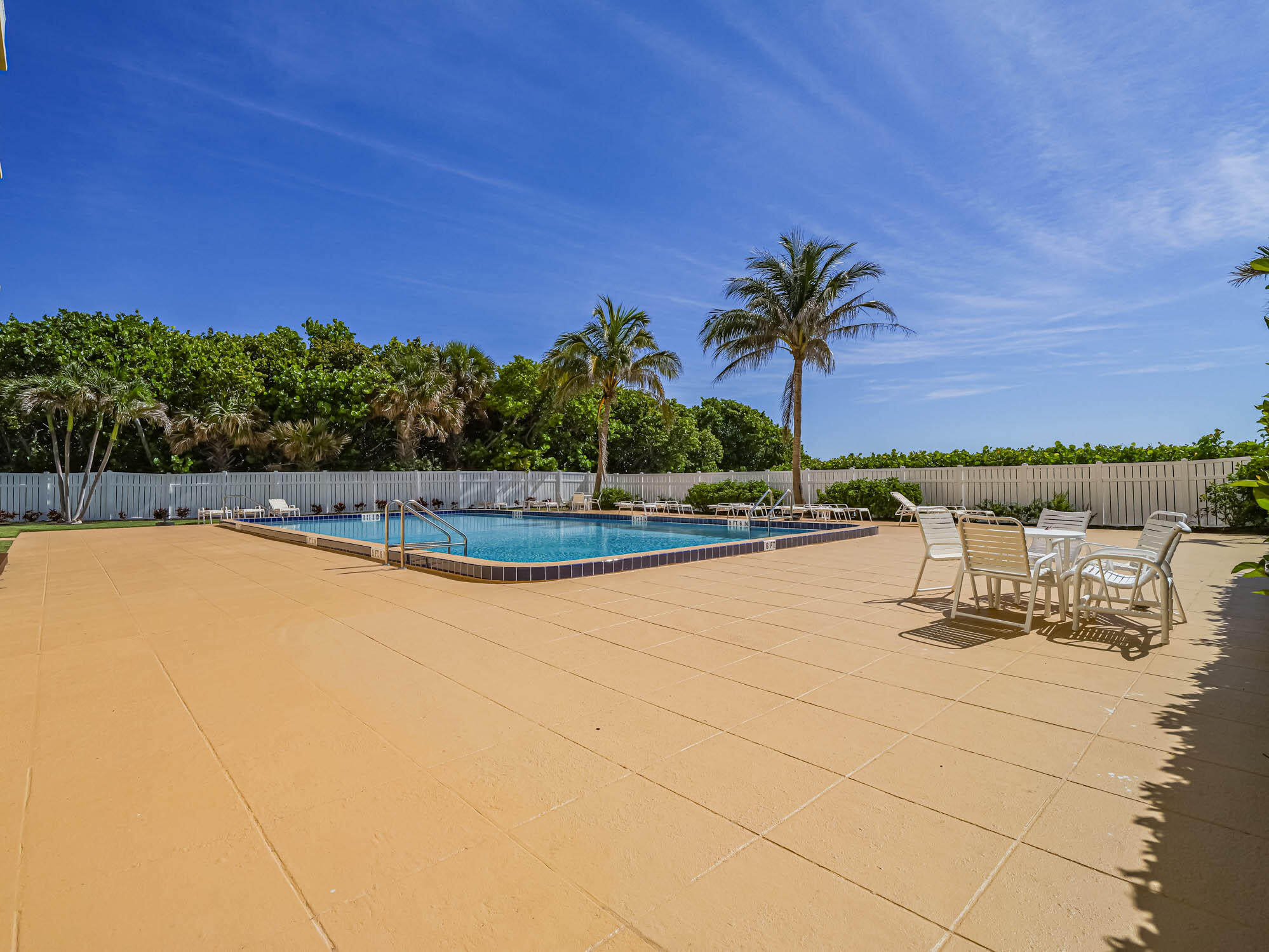 3200 North Hwy A1A, Unit 307 Hutchinson Island, FL 34949 - Photo 5 of 47 a view of a swimming pool and an outdoor space