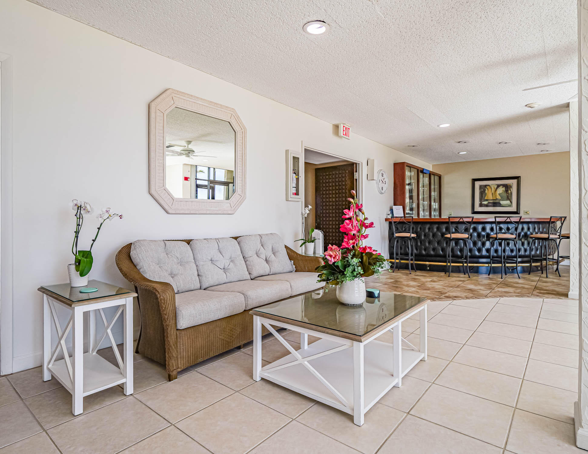3200 North Hwy A1A, Unit 307 Hutchinson Island, FL 34949 - Photo 9 of 47 a living room with furniture and flowers