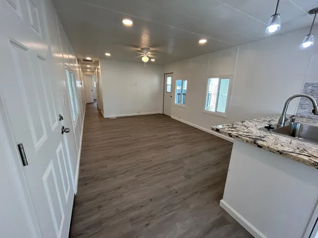 a view of a sink and an entryway in a room