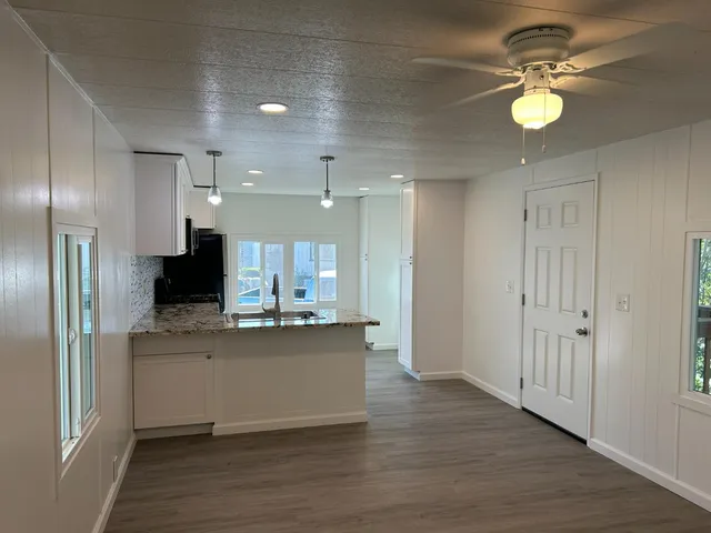 a view of kitchen with center island and stainless steel appliances