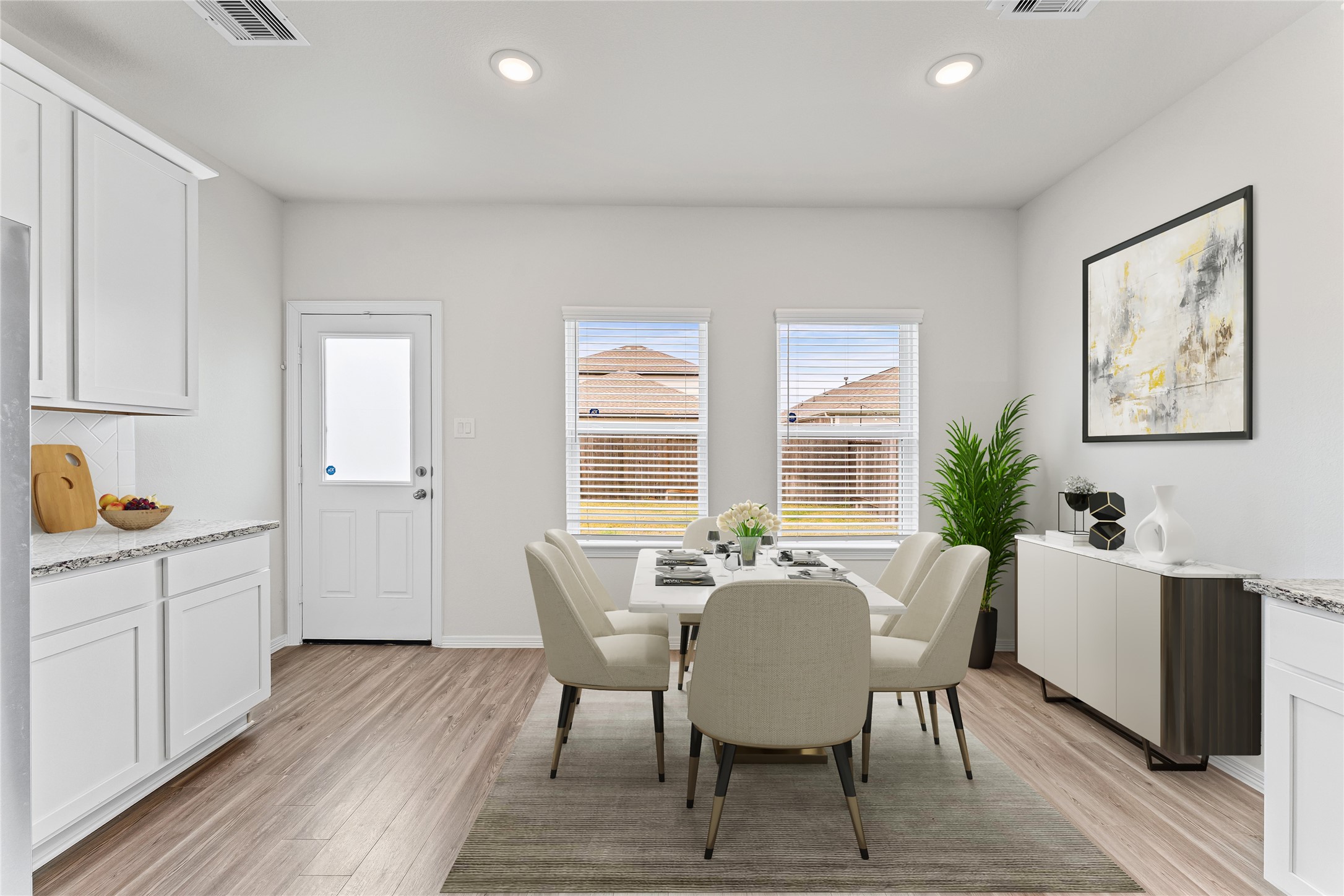 23326 Spring Genesis Lane Katy, TX 77493 - Photo 12 of 32 a view of a dining room with furniture and wooden floor