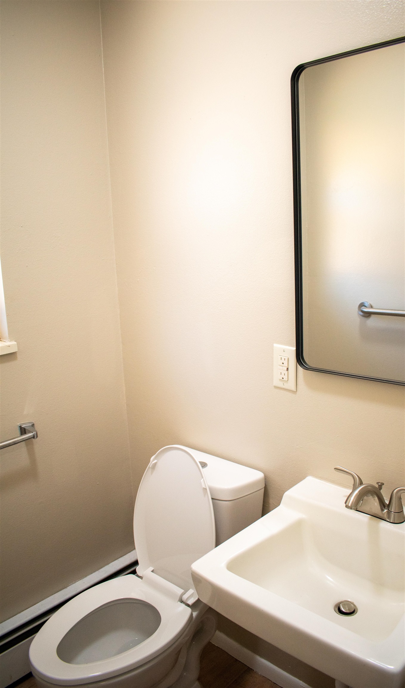 519-29 29 1/4 Road Grand Junction, CO 81504 - Photo 14 of 20 a bathroom with a toilet sink and mirror