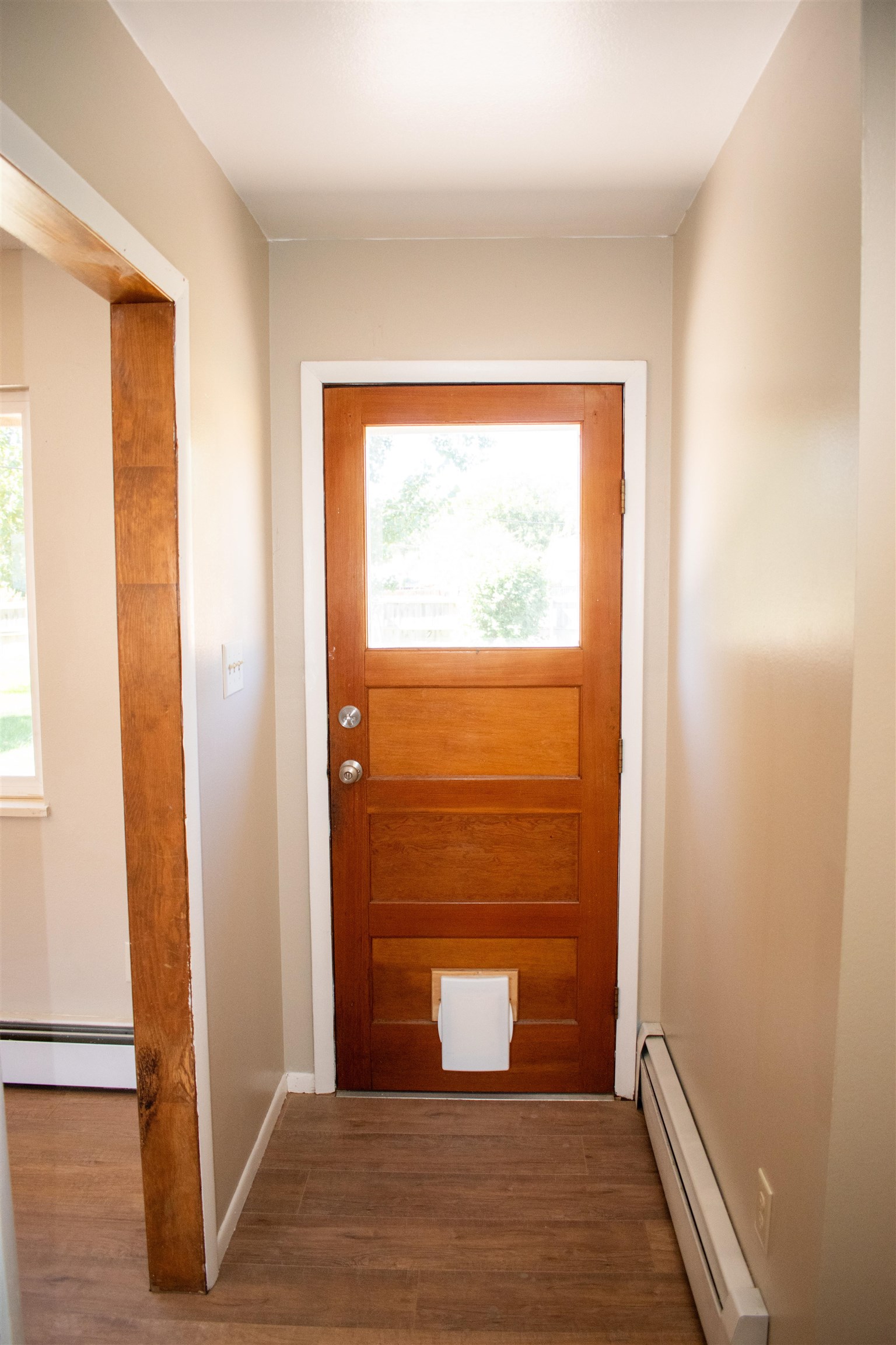 519-29 29 1/4 Road Grand Junction, CO 81504 - Photo 15 of 20 a view of a hallway with wooden floor and a bathroom