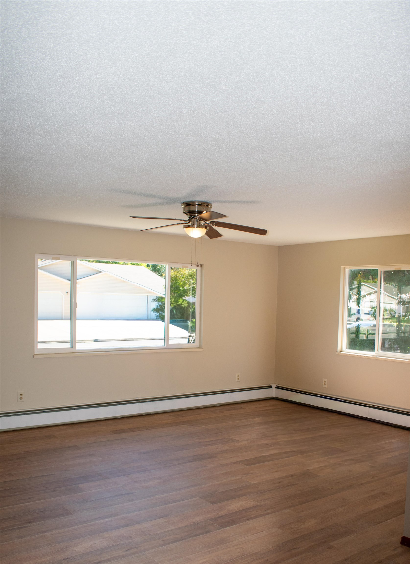 519-29 29 1/4 Road Grand Junction, CO 81504 - Photo 6 of 20 an empty room with wooden floor and windows