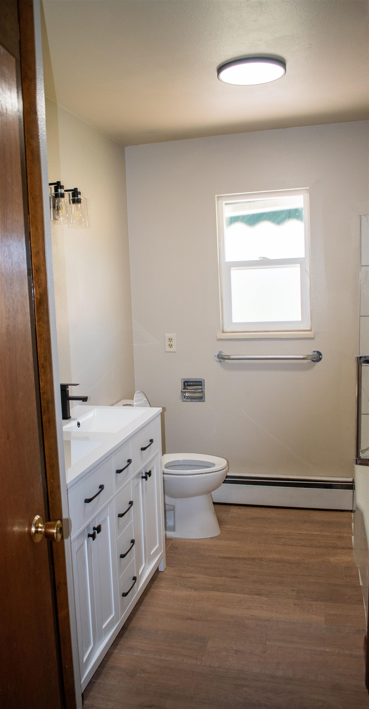 519-29 29 1/4 Road Grand Junction, CO 81504 - Photo 8 of 20 a bathroom with a granite countertop sink a toilet and a mirror