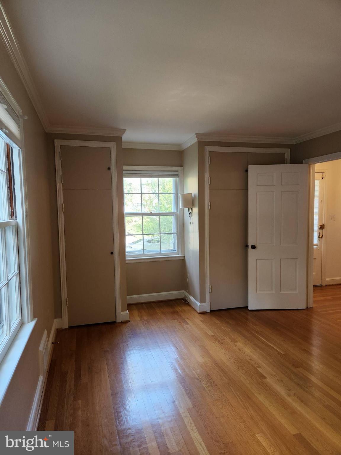 3916 48th Street Northwest Washington, DC 20016 - Photo 15 of 29 an empty room with wooden floor and windows