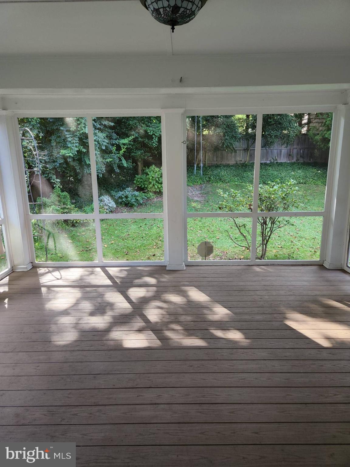 3916 48th Street Northwest Washington, DC 20016 - Photo 27 of 29 a view of room with a large window and wooden floor