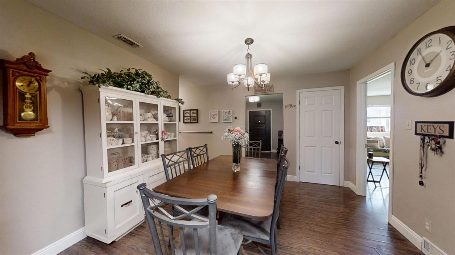 2956 Treen Court Rancho Cordova, CA 95670 - Photo 13 of 67 a view of a dining room with furniture and wooden floor