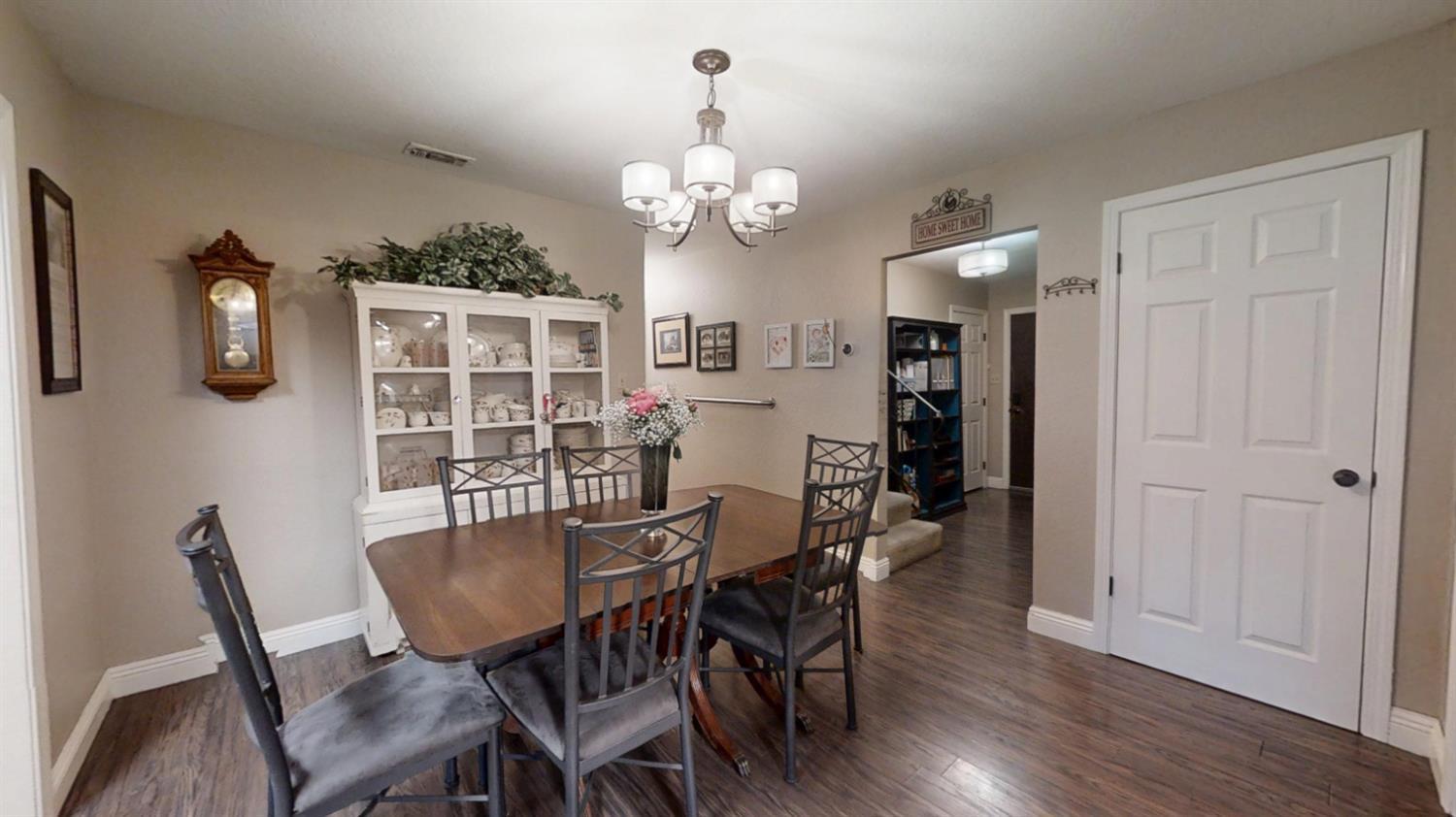 2956 Treen Court Rancho Cordova, CA 95670 - Photo 14 of 67 a view of a dining room with furniture and wooden floor