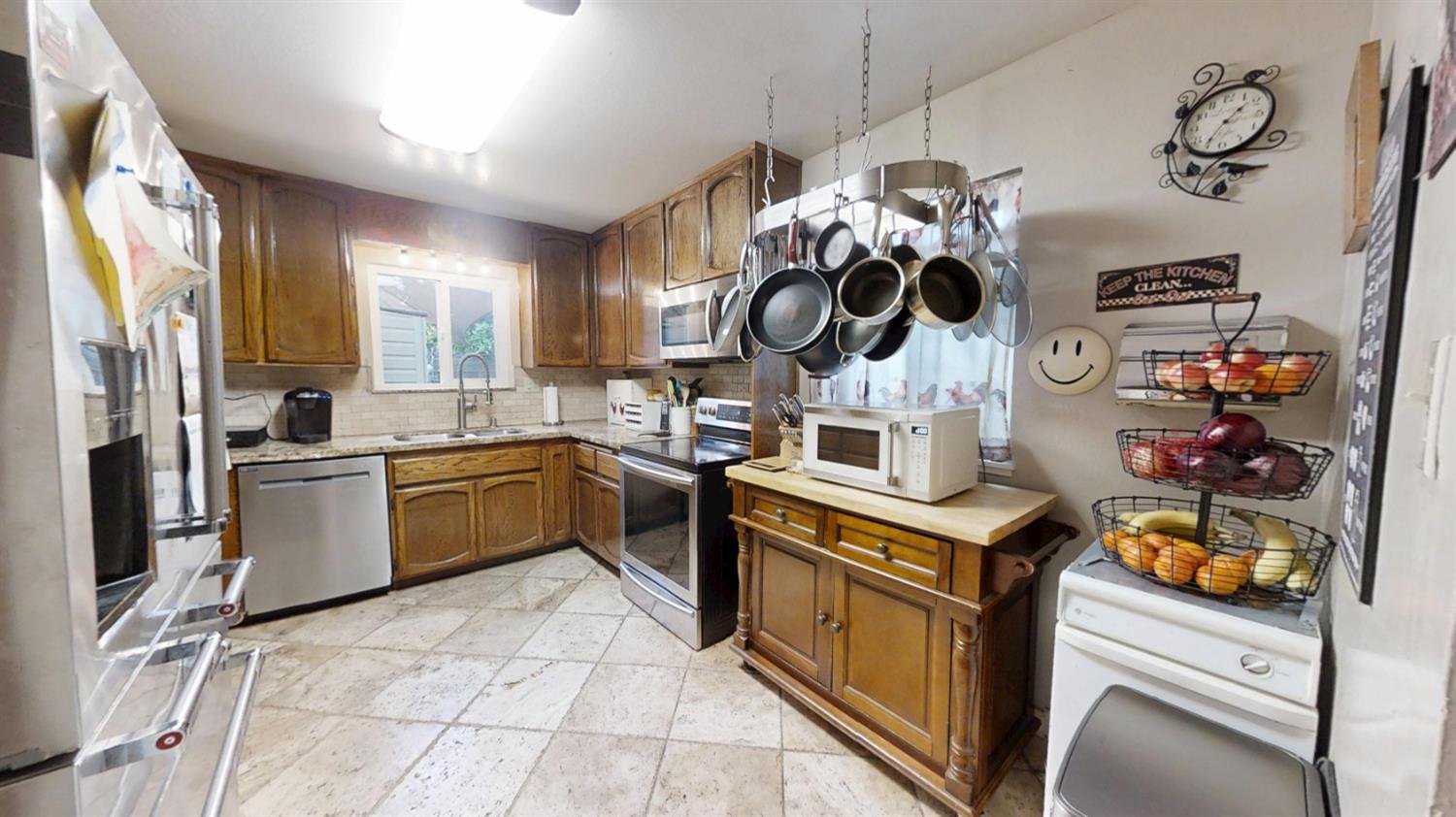 2956 Treen Court Rancho Cordova, CA 95670 - Photo 15 of 67 a kitchen with a stove and a refrigerator