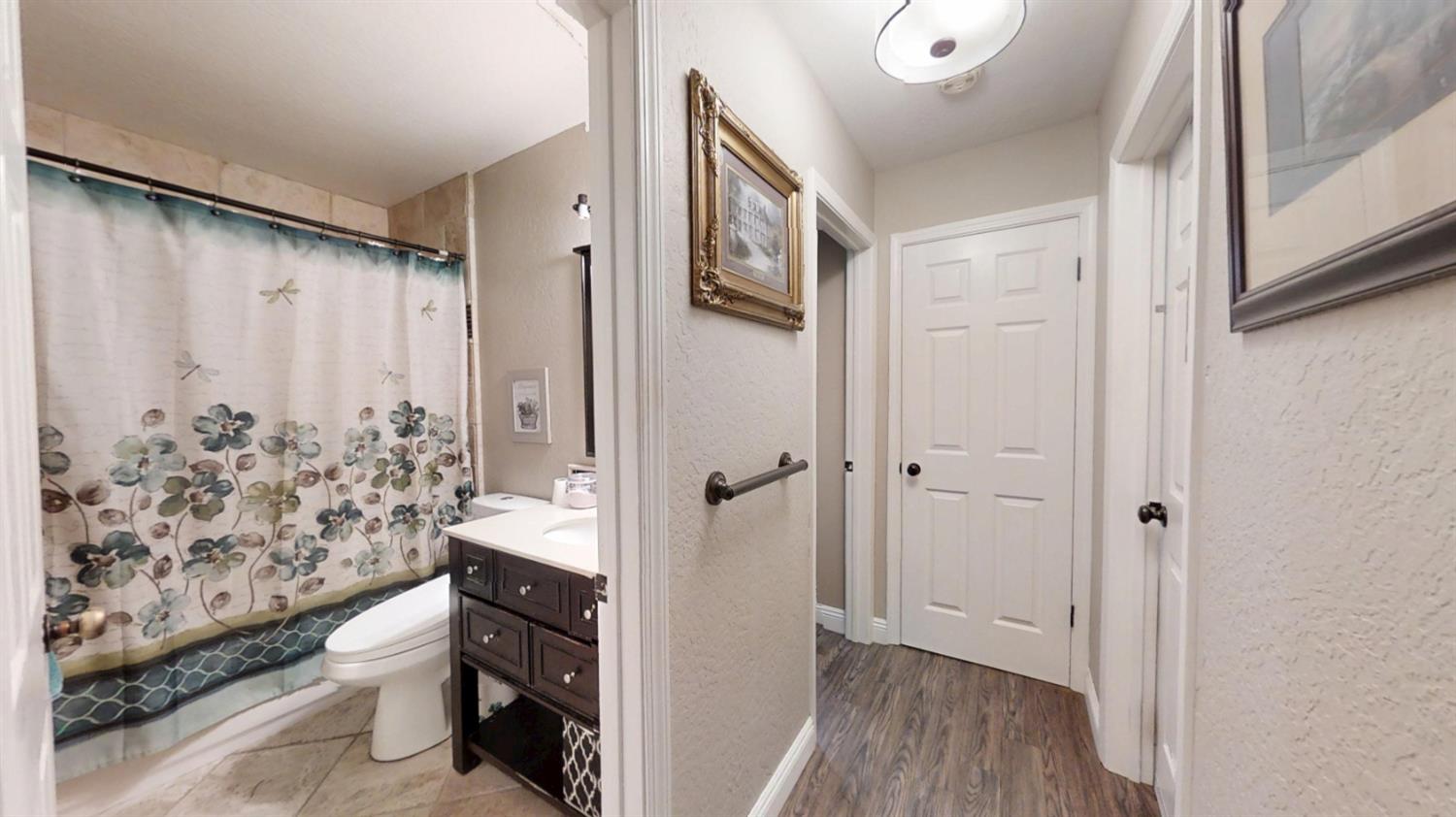 2956 Treen Court Rancho Cordova, CA 95670 - Photo 18 of 67 a bathroom with a toilet a sink and shower