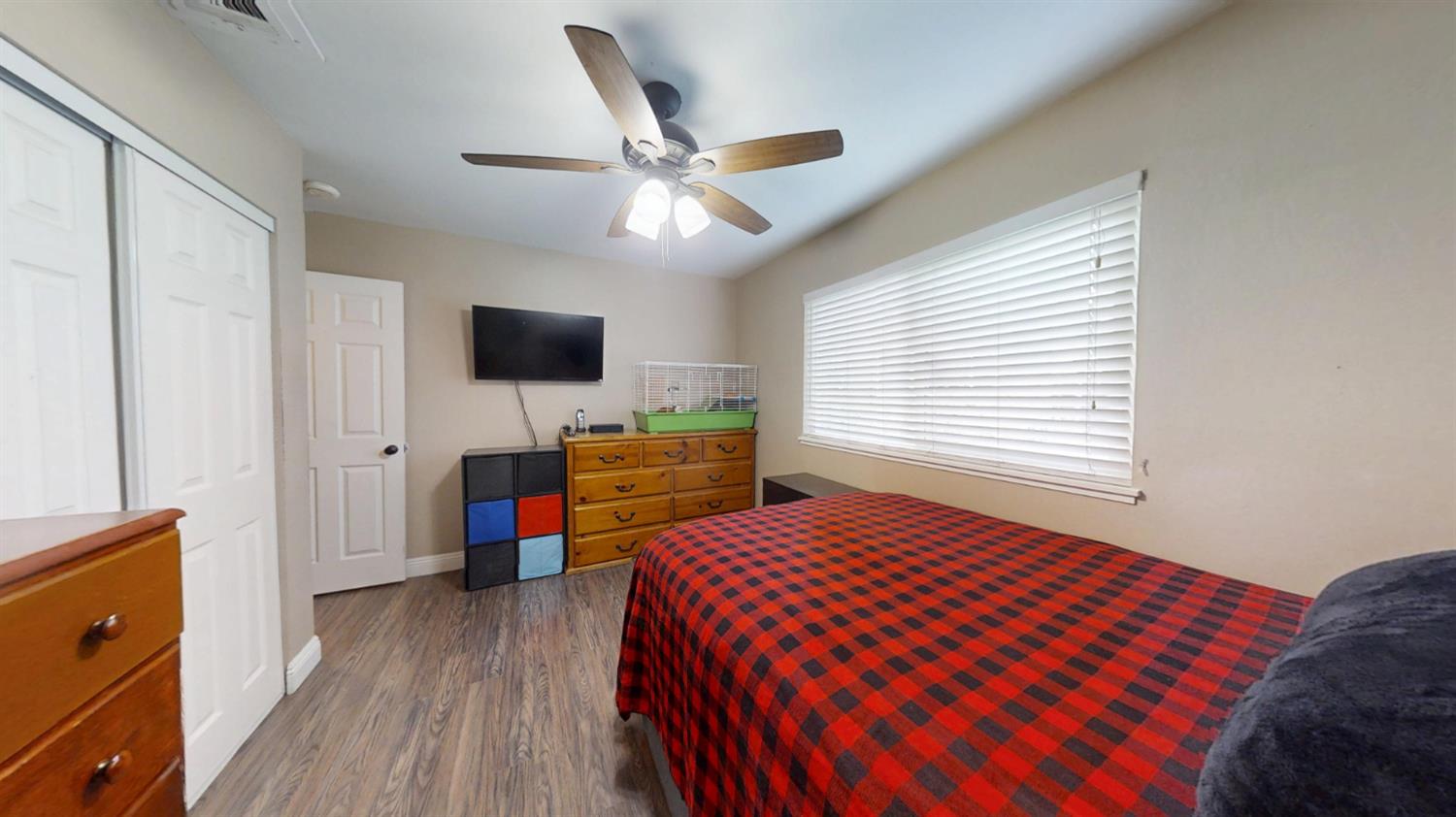 2956 Treen Court Rancho Cordova, CA 95670 - Photo 20 of 67 a bedroom with a bed and a flat screen tv