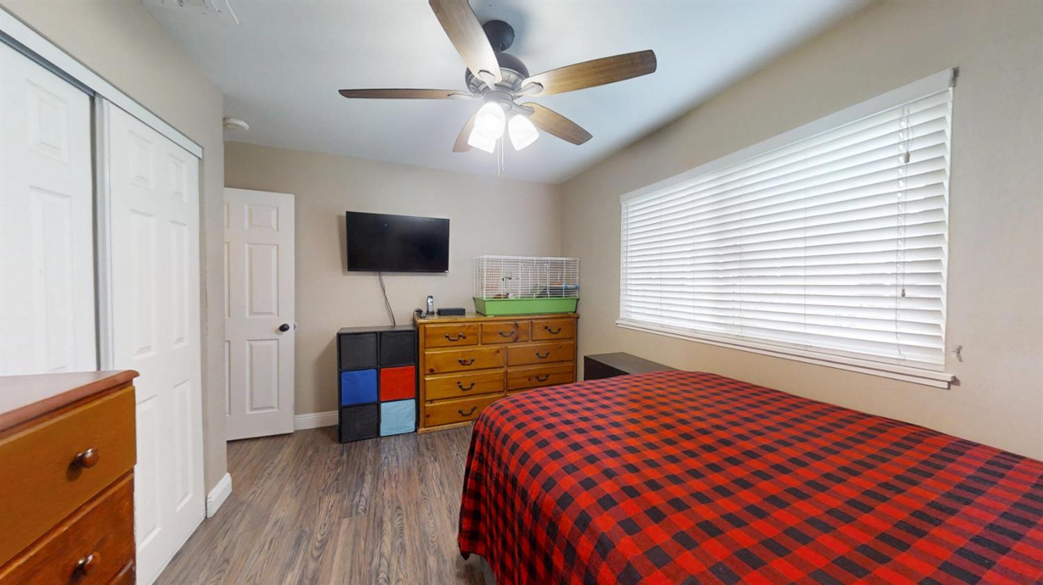 2956 Treen Court Rancho Cordova, CA 95670 - Photo 21 of 67 a bedroom with a bed and a flat screen tv