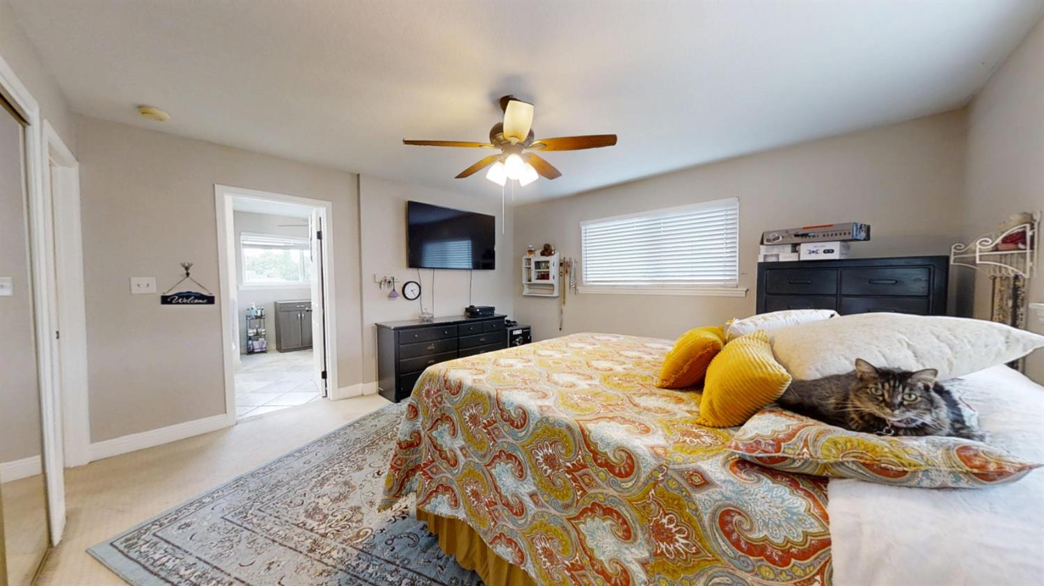 2956 Treen Court Rancho Cordova, CA 95670 - Photo 31 of 67 a bedroom with a bed and a chandelier