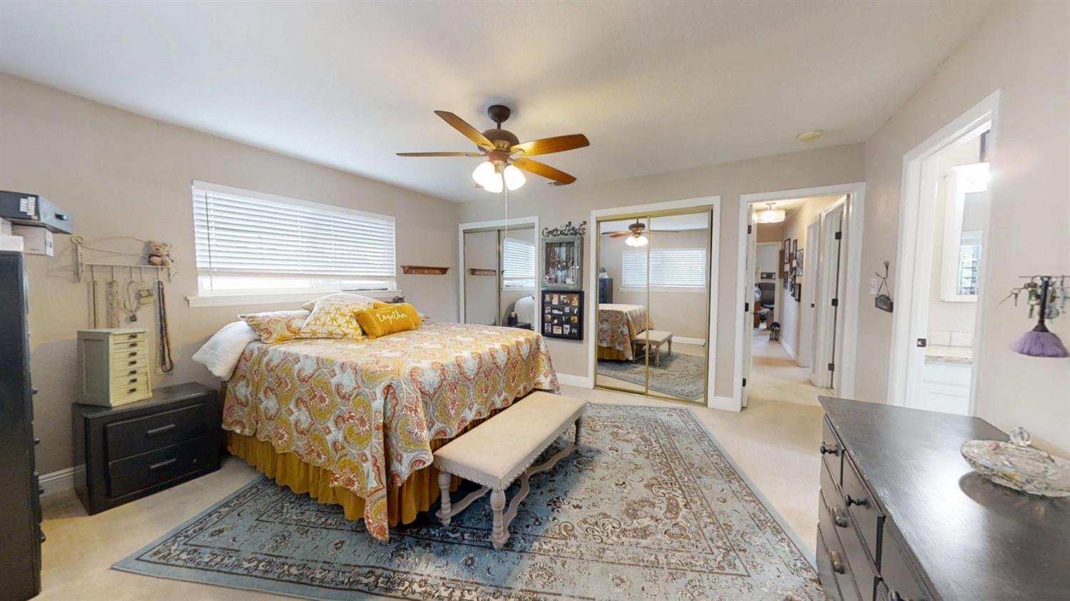 2956 Treen Court Rancho Cordova, CA 95670 - Photo 33 of 67 a bedroom with a bed and a chandelier