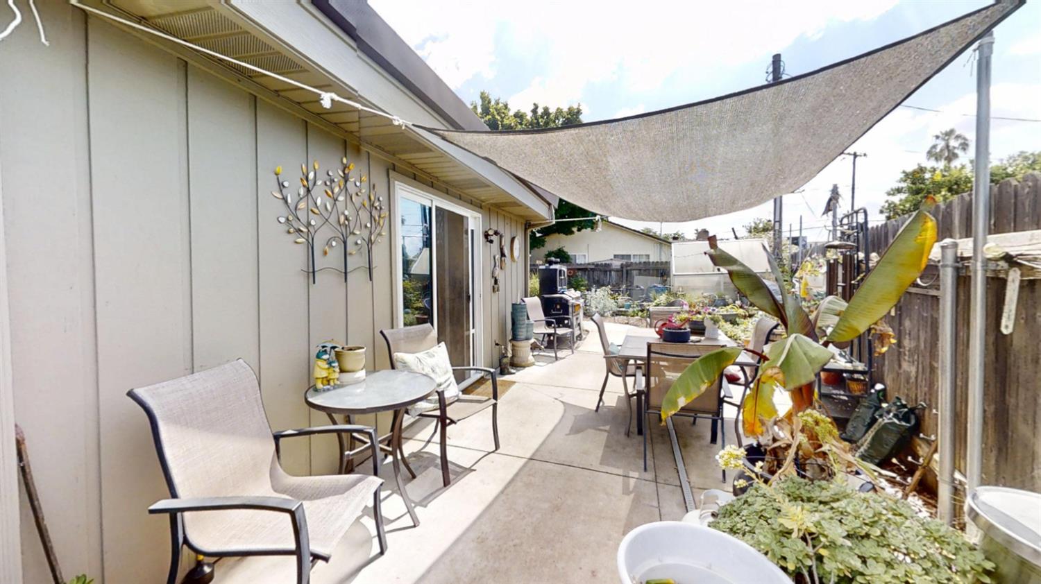 2956 Treen Court Rancho Cordova, CA 95670 - Photo 53 of 67 a view of outdoor dining space with a table and chairs and potted plants