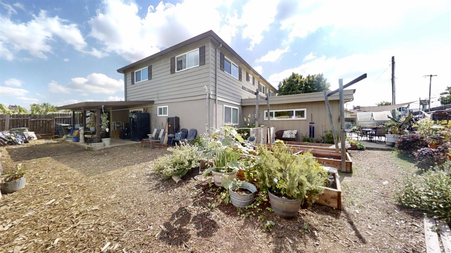 2956 Treen Court Rancho Cordova, CA 95670 - Photo 55 of 67 a front view of a house with a yard and outdoor seating