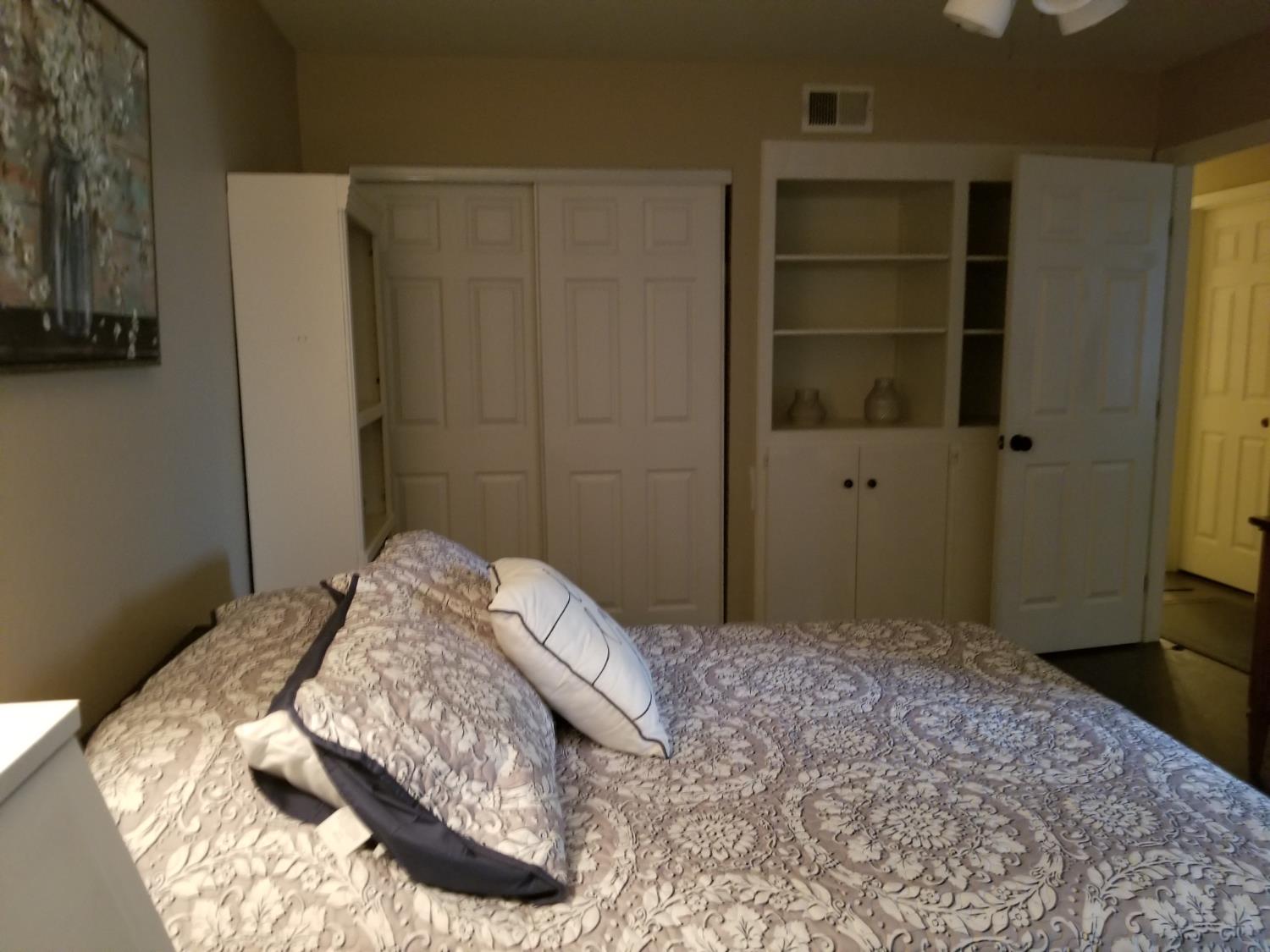 2956 Treen Court Rancho Cordova, CA 95670 - Photo 63 of 67 a bedroom with a bed and a cabinet
