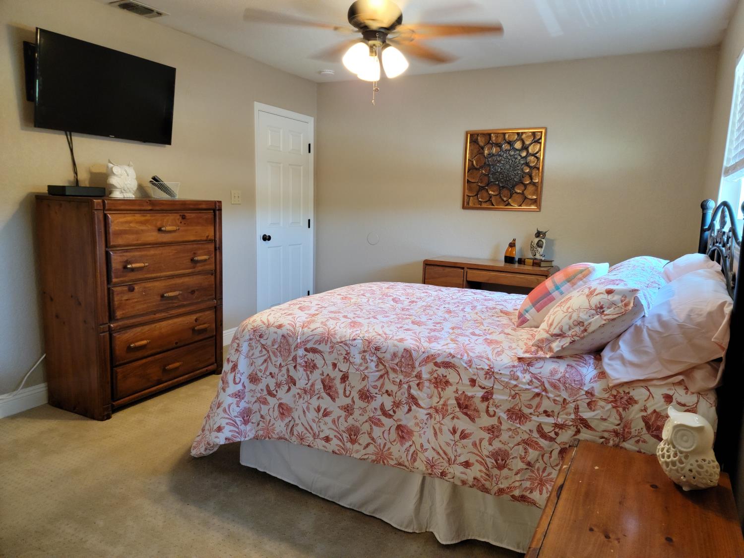 2956 Treen Court Rancho Cordova, CA 95670 - Photo 66 of 67 a bedroom with a bed and a flat screen tv