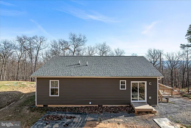 a view of a balcony with wooden floor and fence