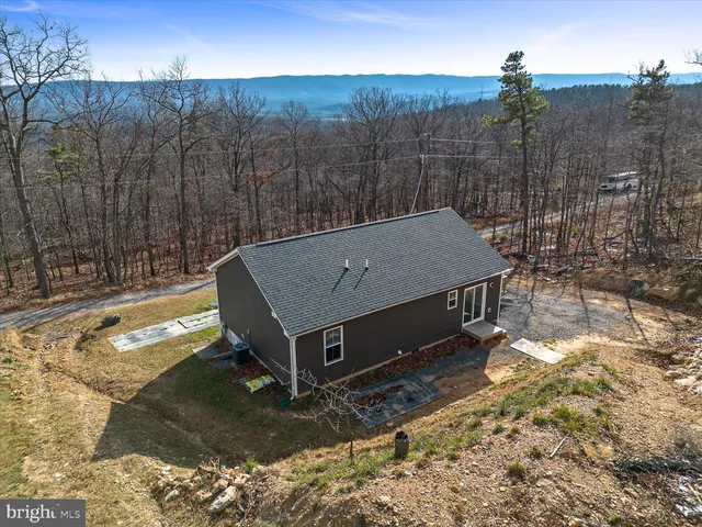 a backyard of a house with lots of green space