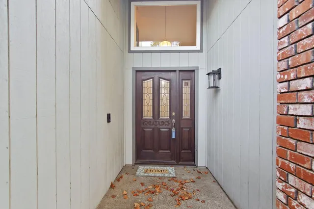 a view of an entryway with a hallway