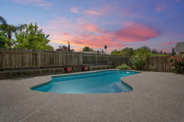 a view of a swimming pool with lounge chair