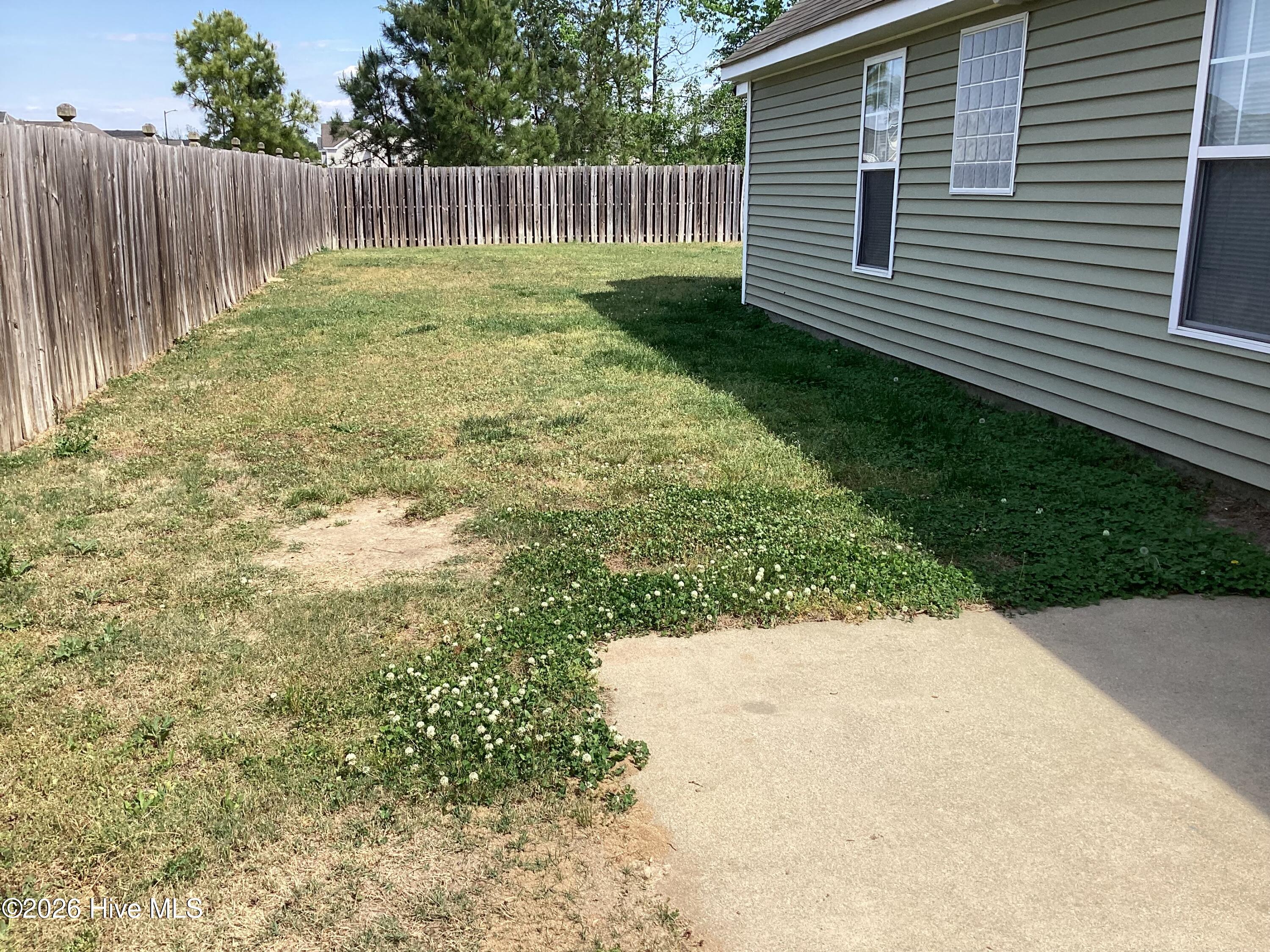 823 Sugar Creek Road Rocky Mount, NC 27804 - Photo 14 of 17 Side yard,outside gate, patio