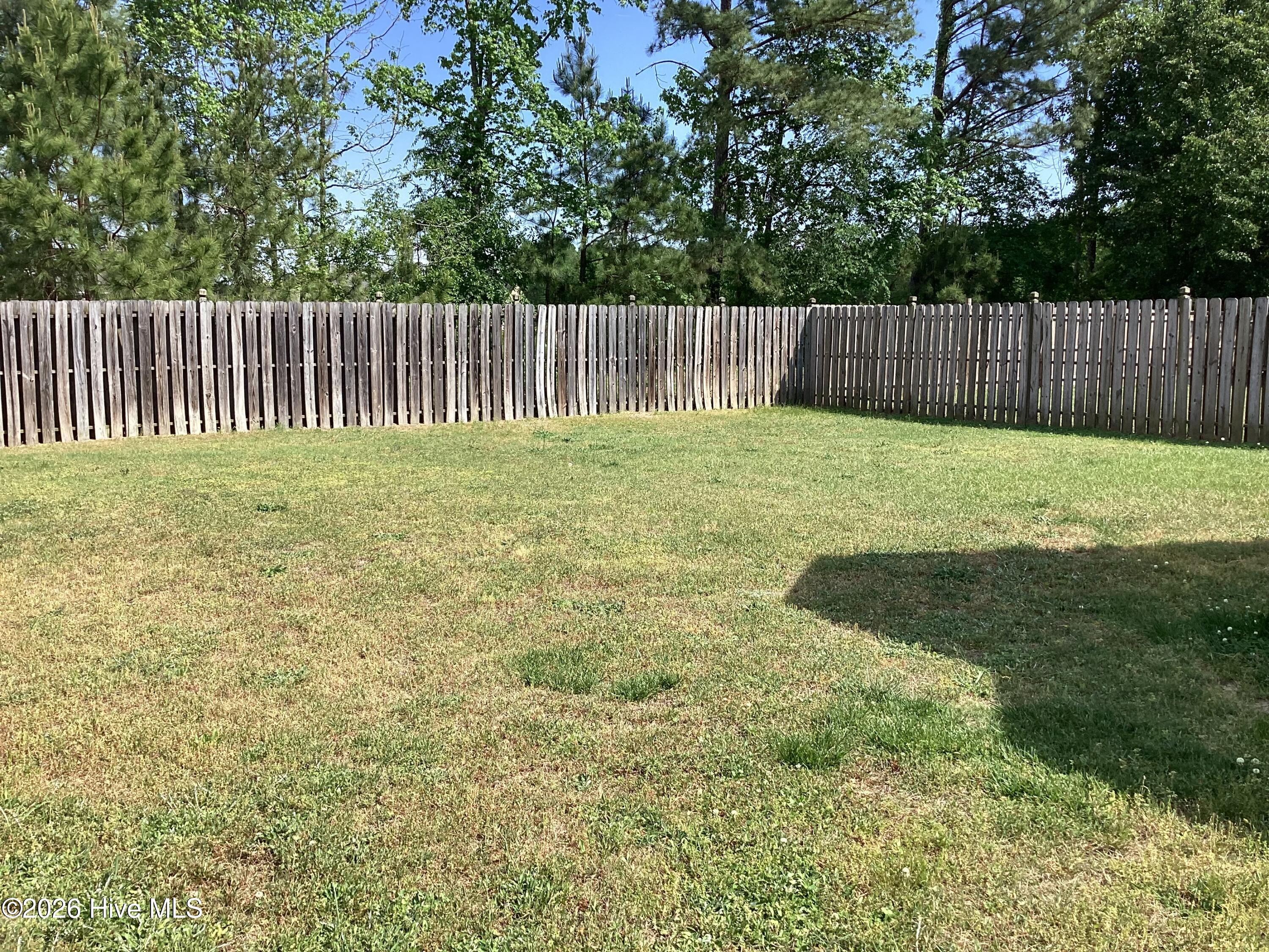 823 Sugar Creek Road Rocky Mount, NC 27804 - Photo 15 of 17 Large fenced back yard with entrance from kitchen area