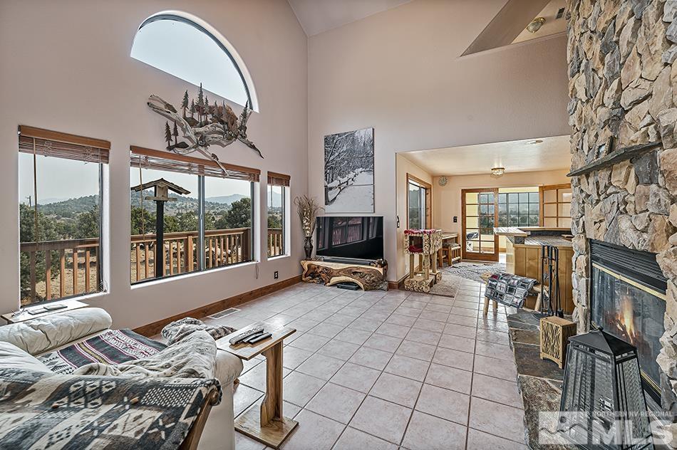 4090 Whiskey Flat Road Reno, NV 89521 - Photo 11 of 29 a bedroom with furniture and a large window