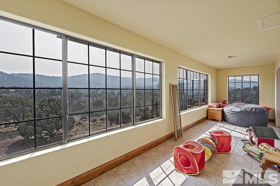 4090 Whiskey Flat Road Reno, NV 89521 - Photo 13 of 29 a bedroom with furniture and a window