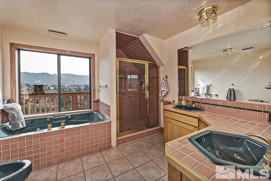 4090 Whiskey Flat Road Reno, NV 89521 - Photo 16 of 29 a living room with stainless steel appliances furniture a rug and a view of kitchen