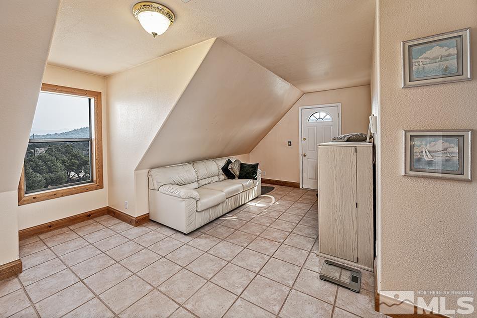 4090 Whiskey Flat Road Reno, NV 89521 - Photo 20 of 29 a living room with a couch and a window