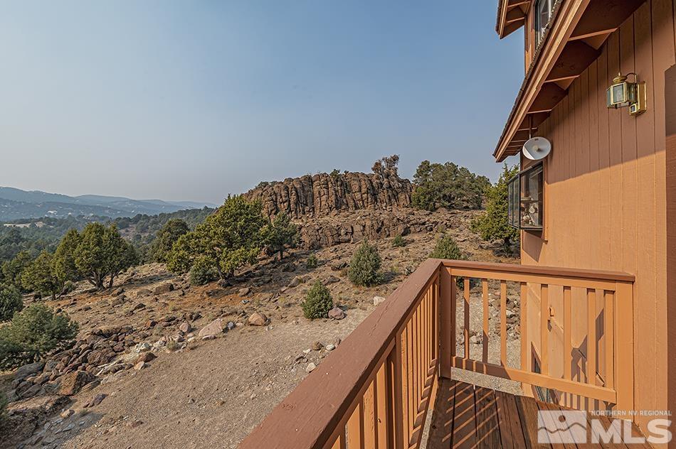 4090 Whiskey Flat Road Reno, NV 89521 - Photo 28 of 29 a view of balcony with wooden floor and fence