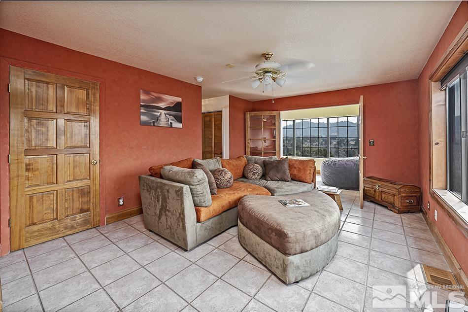 4090 Whiskey Flat Road Reno, NV 89521 - Photo 4 of 29 a living room with furniture and a window