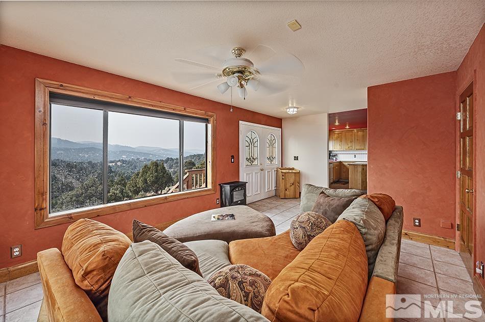4090 Whiskey Flat Road Reno, NV 89521 - Photo 6 of 29 a living room with furniture and a large window