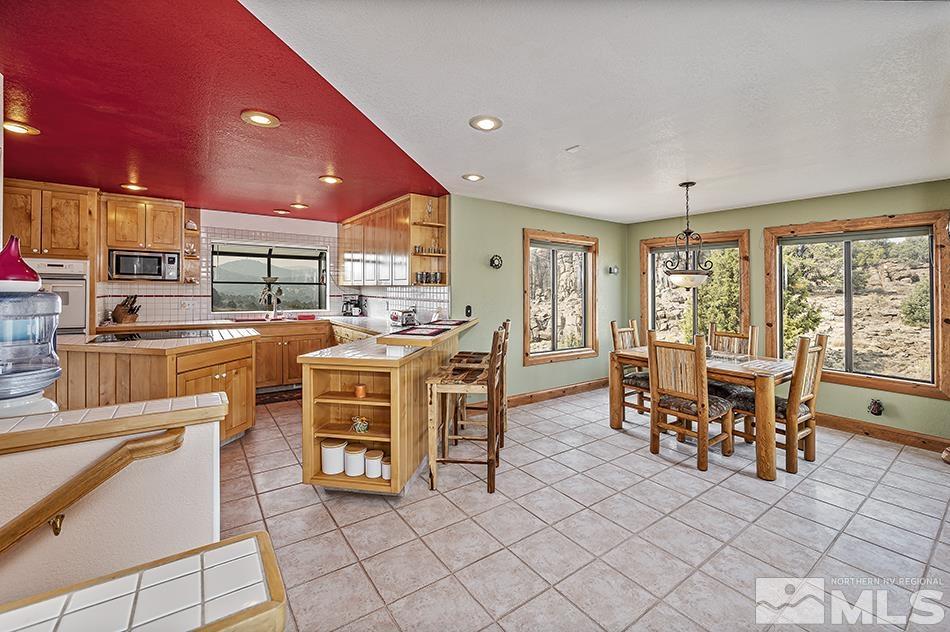 4090 Whiskey Flat Road Reno, NV 89521 - Photo 9 of 29 a view of a dining room with furniture window and outside view