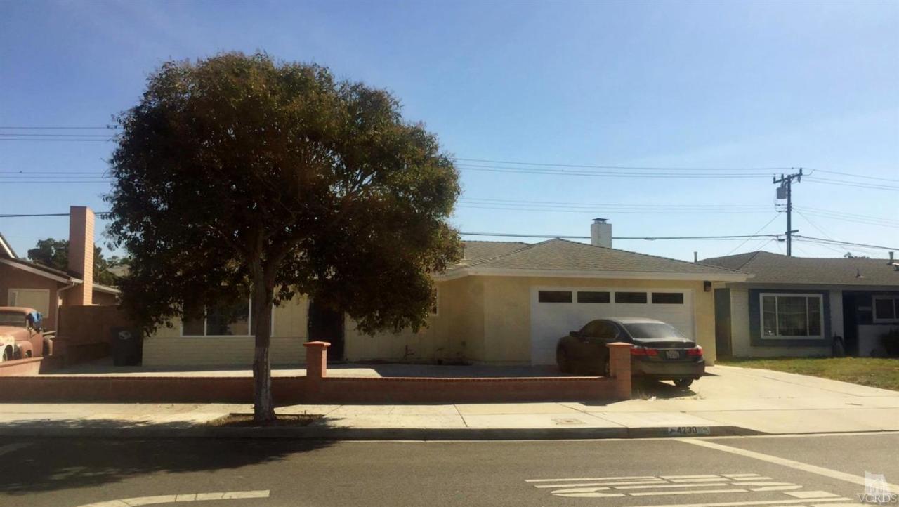 4230 Reeder Avenue Oxnard, CA 93033 - Photo 1 of 12 a front view of a house with a yard