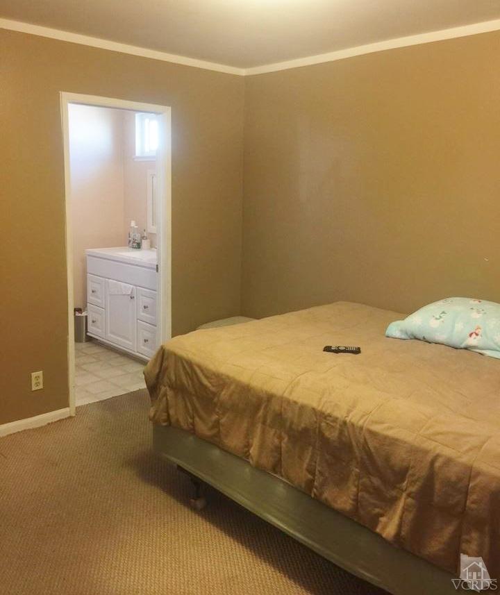 4230 Reeder Avenue Oxnard, CA 93033 - Photo 11 of 12 a bedroom with a bed and window