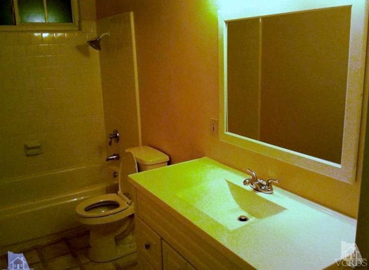 4230 Reeder Avenue Oxnard, CA 93033 - Photo 9 of 12 a bathroom with a sink and a tub