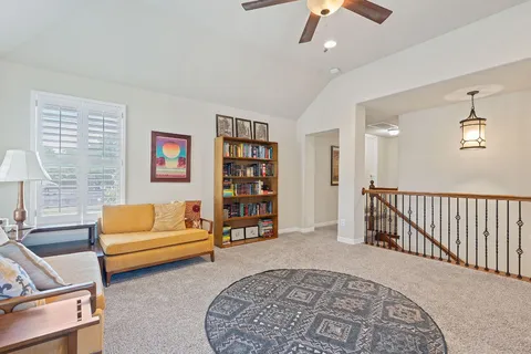 a living room with furniture and a rug