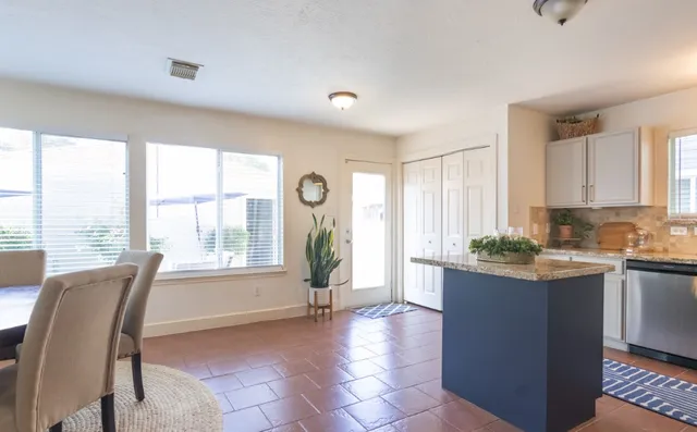 a view of a kitchen and dining room