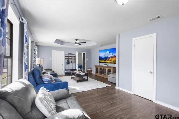 a living room with furniture and a large window