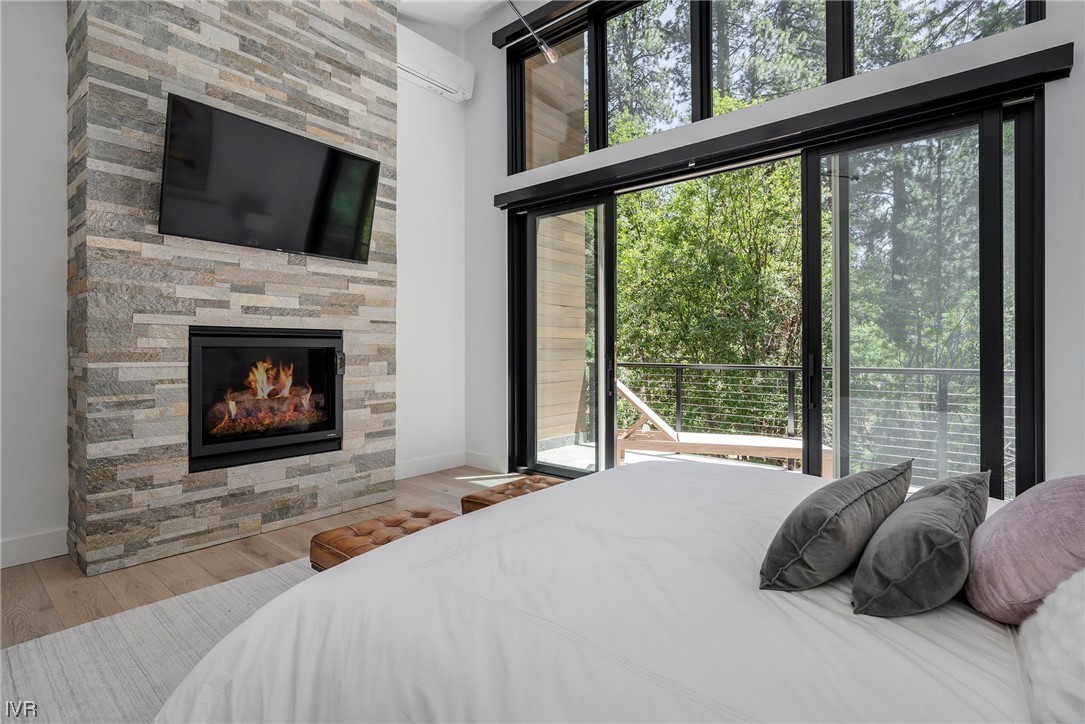 199 Tramway Road Incline Village, NV 89451 - Photo 13 of 49 a bedroom with a bed and a fireplace