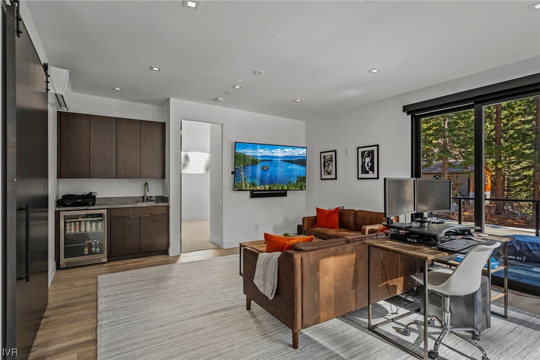 199 Tramway Road Incline Village, NV 89451 - Photo 16 of 49 a living room with stainless steel appliances kitchen island granite countertop furniture a large window and a refrigerator
