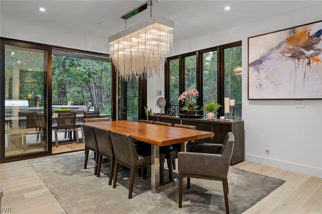 199 Tramway Road Incline Village, NV 89451 - Photo 35 of 49 a dining room with furniture large windows and a rug
